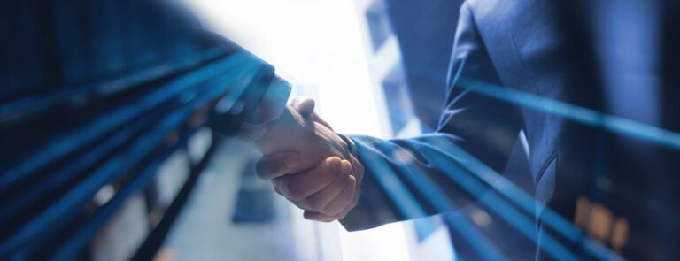 Close up of two businessmen shaking hands