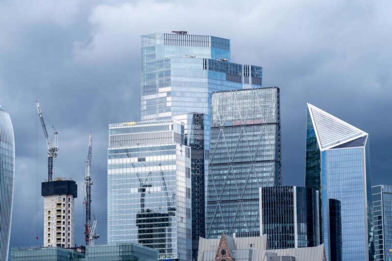 Picture of modern glass skyscrapers in the London financial district against moody sky
